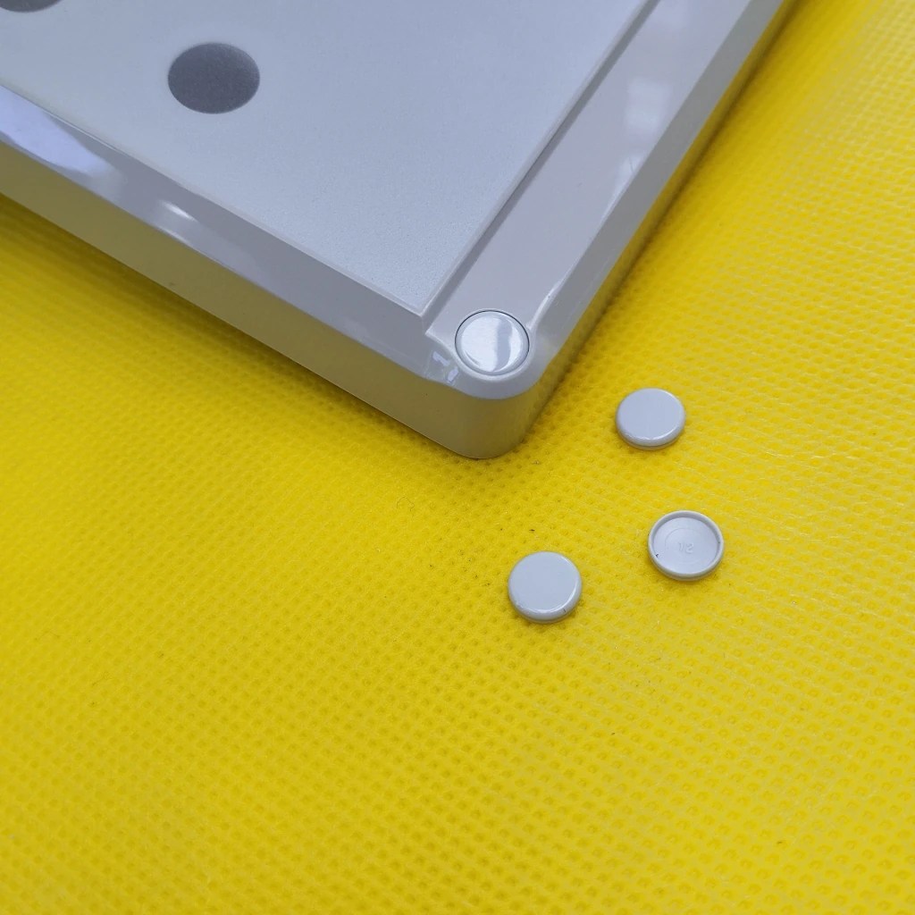 Schraubenabdeckungen für Zufällige Personenauswahl Gerät